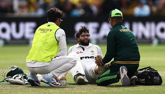 Pakistans Imam-ul-Haq receives medical attention after sustaining an injury during the first Test against England at Headingley in Leeds on August 19, 2026. — Reuters