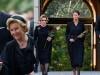 Queen Sonja takes poignant pause before King Harald's sea of flowers