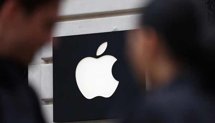 People walk past an Apple logo at an Apple store in Paris, France, April 23, 2025.— Reuters