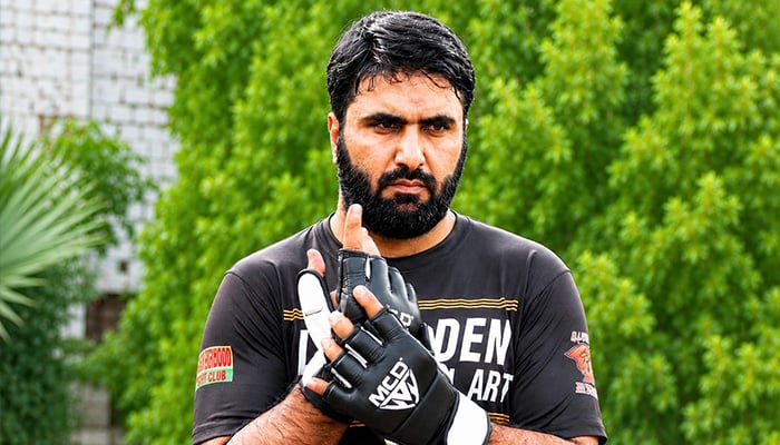 Pakistani martial artist Irfan Mehsood poses for a photo, who set Guinness World Record for full-extension one-hand punches. — Reporter