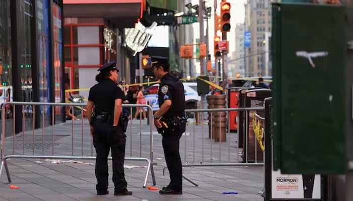 Members of the NYPD stand guard at the scene of an officer-involved shooting, in Times Square, New York City, US, August 31, 2026. — Reuters