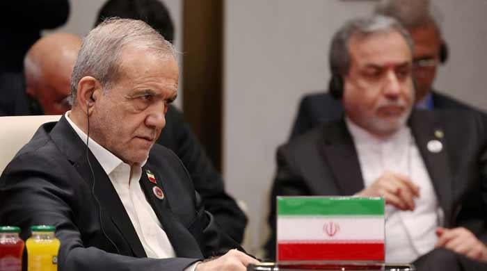 Iran urges US to comply with interim deal after Trump threatens further strikes