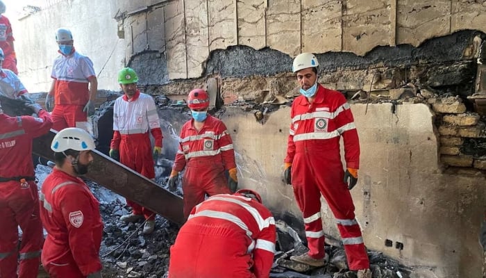 Iranian Red Crescent Society members search through the rubble for victims after Israeli strikes, at an unspecified location in Iran, in this undated image released June 17, 2025 and obtained from social media. — Reuters