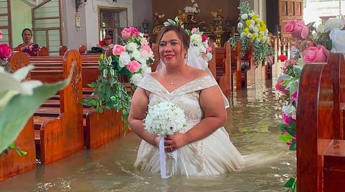 'Nothing could stop their union': Philippine couple married in hip-deep floodwaters