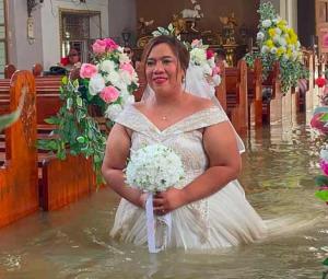 'Nothing could stop their union': Philippine couple married in hip-deep floodwaters