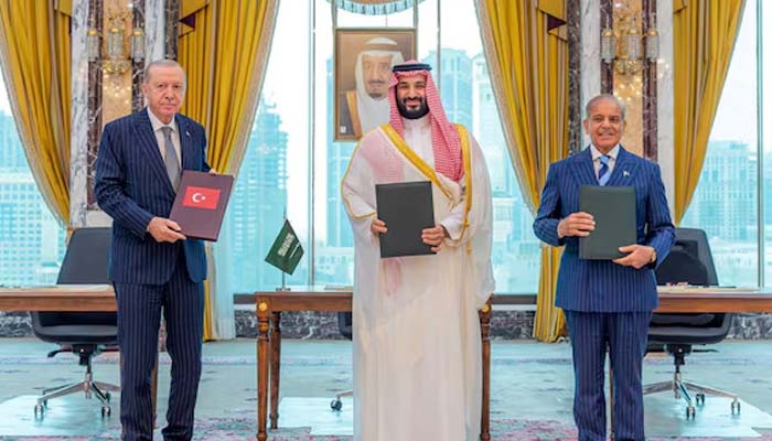 Turkish President Tayyip Erdogan, Saudi Crown Prince Mohammed bin Salman, and Prime Minister Shehbaz Sharif pose after signing a joint defence agreement in Makkah, Saudi Arabia, August 7, 2026. — Reuters