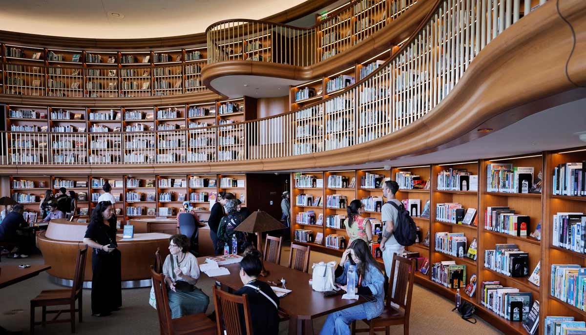 Visitors gather in the library of the new Lucas Museum of Narrative Art during a media preview of the 300,000 square foot structure in Exposition Park on September 2, 2026 in Los Angeles, California.— AF
