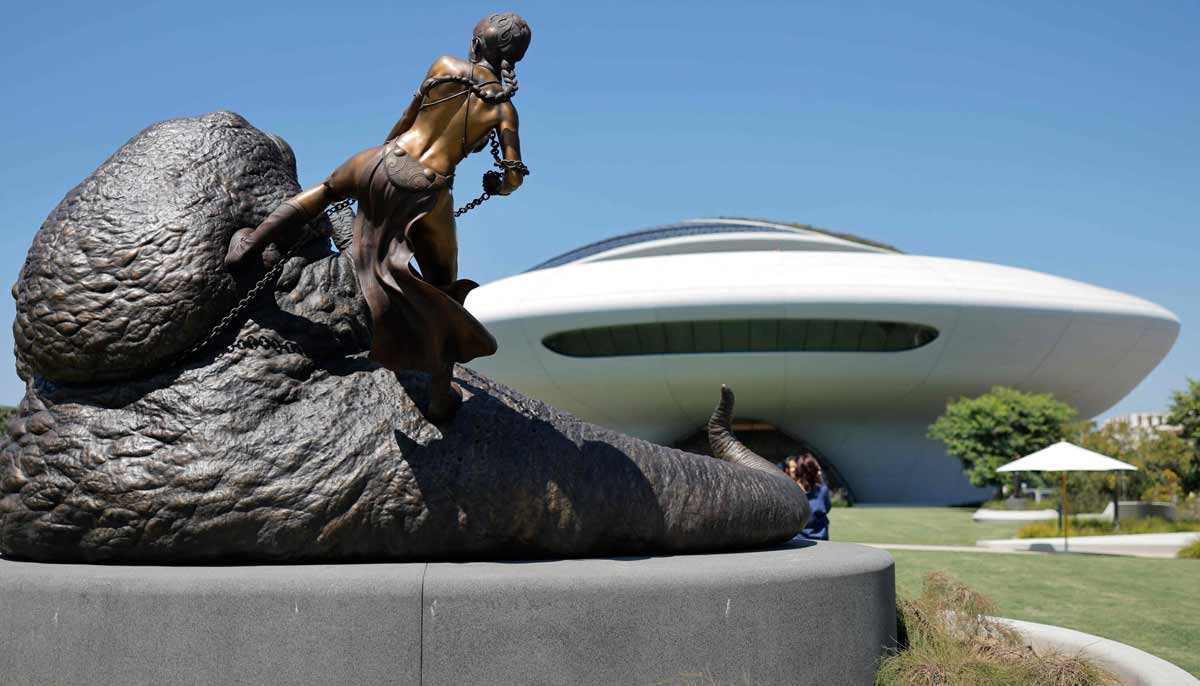 A sculpture of Princess Leia and Jabba The Hut, characters from Star Wars, are displayed outside the new Lucas Museum of Narrative Art during a media preview of the 300,000 square foot structure in Exposition Park on September 2, 2026 in Los Angeles, California. — AFP
