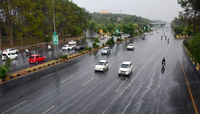Vehicles seen driving through the roads of Islamabad as the city received heavy pre-monsoon rains. — Online/File