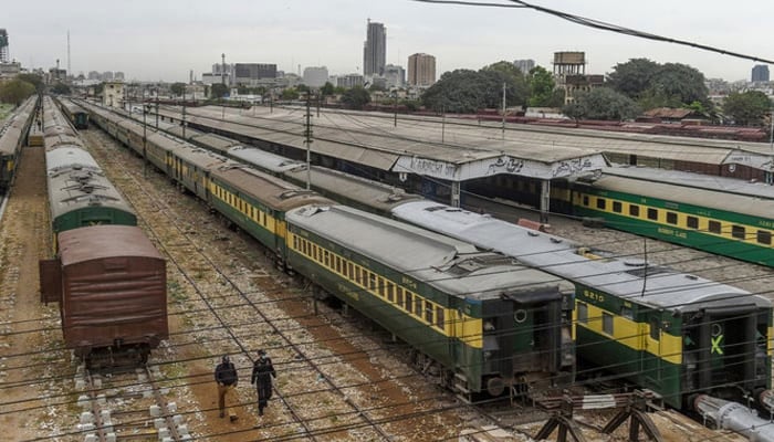 PM Shehbaz, ADB VP discuss 'early groundbreaking' of strategic ML-1 project 8 Policemen walk along trains stationed on a deserted platform at Karachi Cantonment railway station. — AFP/File