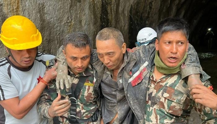 Members of the Nepal Army search and rescue team carry a Chinese national after he was rescued alive from a tunnel at the Upper Trishuli-1 Hydropower Project following devastating floods and mudslides, in Rasuwa, Nepal, September 5, 2026. — Reuters