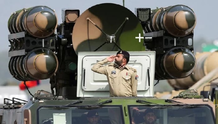 Pakistani Army soldier salutes while standing on an air defence missile system during the Pakistan Day military parade in Islamabad, Pakistan, March 23, 2022.— Reuters