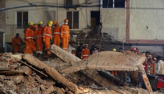 National Disaster Response Force (NDRF) personnel watch as debris is lifted, during a rescue operation at the site of a building collapse in New Delhi, India, September 6, 2026.  — Reuters