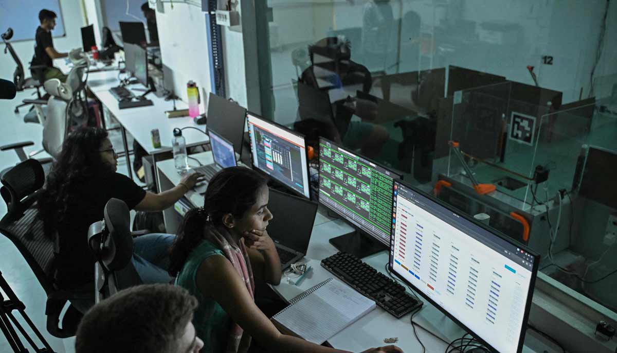 Employees monitoring a cancer detection test inside a laboratory at the Dognosis facility in Kempohalli village on the outskirts of Bengaluru.— AFP