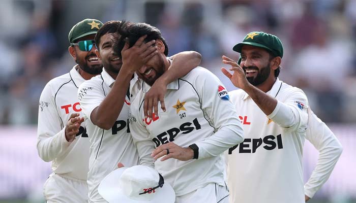 Salman Agha is mobbed by his teammates after taking a brilliant catch during the second Test against England on August 27, 2026. — AFP