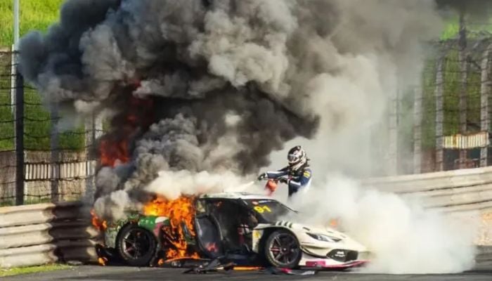 Racing driver abandons own race to pull rival from burning Ferrari at China GT