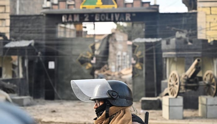 A military officer walks through the affected area a day after loud explosions that left people dead and injured at a military barracks in Viacha, Bolivia, on September 5, 2026. — Reuters