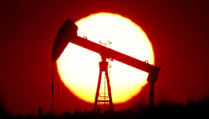 The sun sets behind an oil pump outside Saint-Fiacre, near Paris, France, September 17, 2019. — Reuters