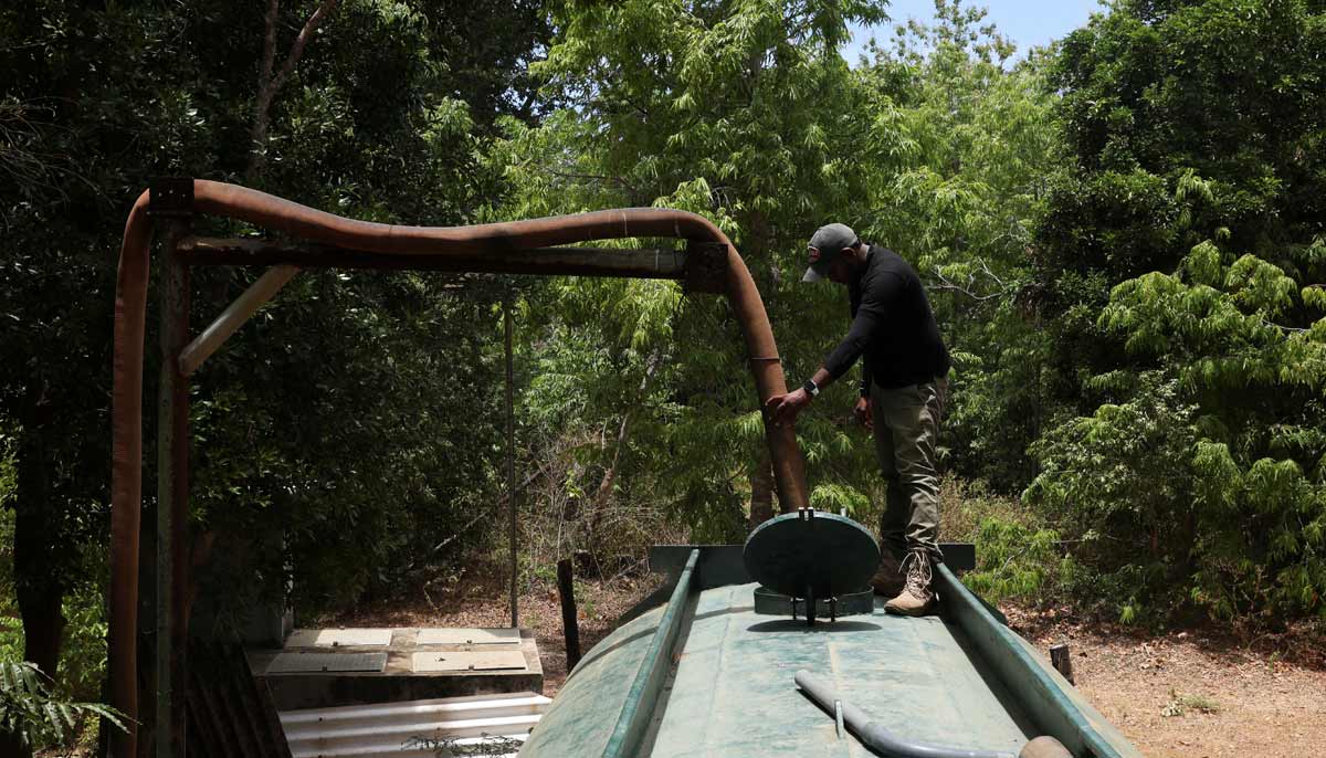 A worker fills a water tanker from a river in Yala National Park, in southern Sri Lanka, August 25, 2026.— Reuters