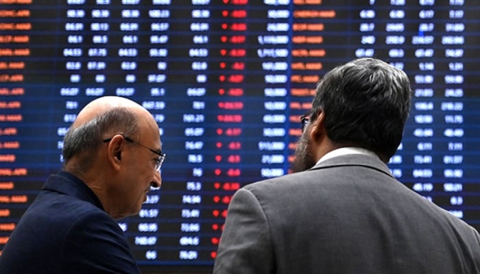 Stockbrokers react while monitoring share prices at the Pakistan Stock Exchange (PSX) in Karachi on March 2, 2026. — AFP