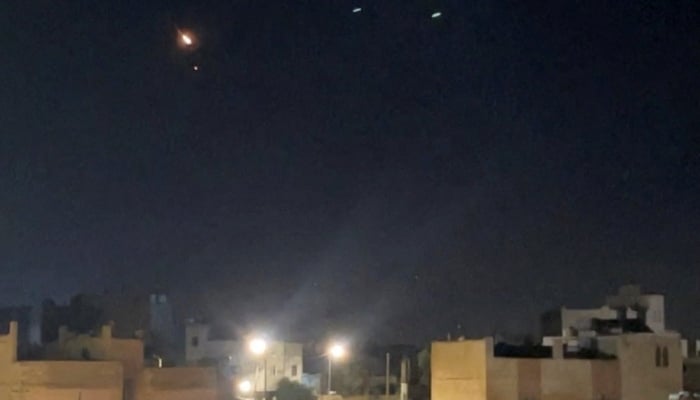 A flash of light appears in the sky as air defence operates to intercept projectiles fired by Irans Revolutionary Guard, in Ash-Shajarah, Jordan, September 9, 2026. — Reuters