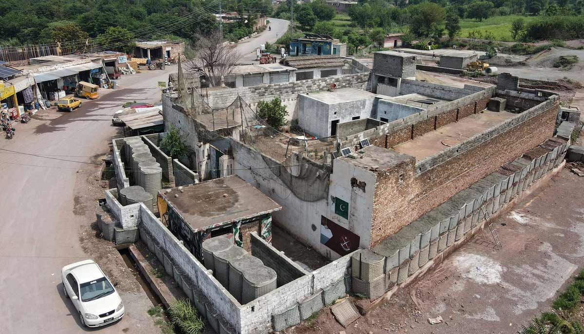 A police post fortified with mesh barriers and a newly built boundary wall, as a new line of defence against militant drone and aerial attacks at Bara in Khyber Pakhtunkhwa. — AFP