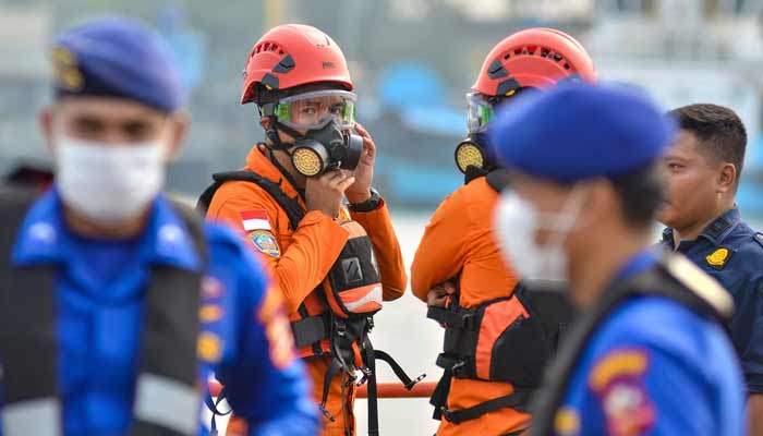 Officers from Banten Basarnas, wearing personal protective equipment, prepare alongside Water Police officers for the second day of the search operation, at Pelindo Regional 2 Port, in Cilegon, Banten, on September 9, 2026, to locate the five missing journalists.— AFP