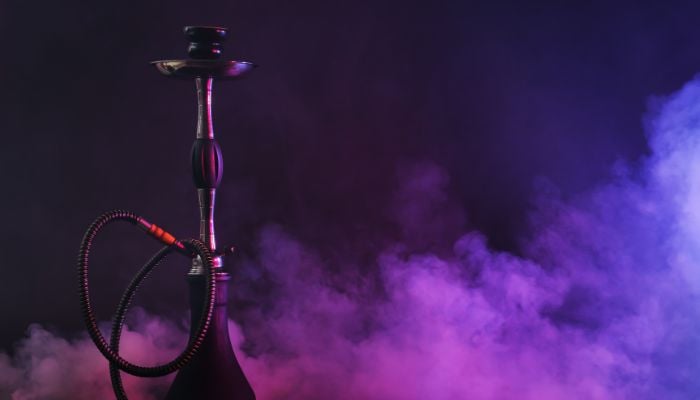A shisha can be seen with somke around it. — Canva