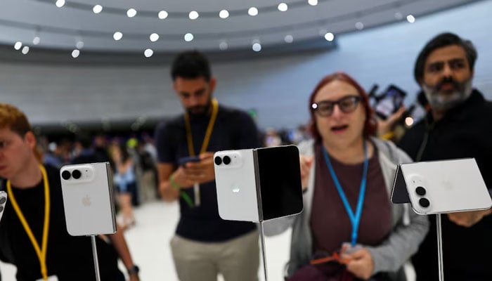 People look at the new foldable iPhone Duo devices on display during Apples event at the Steve Jobs Theater in Cupertino, California, US September 9, 2026. — Reuters