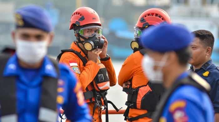 Rescuers comb the seas for missing Indonesian journalists on volcano mission