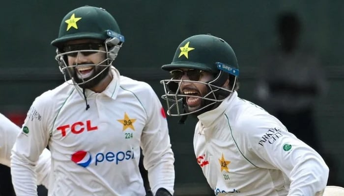 Pakistans Mohammad Rizwan (left) and Imam-ul-Haq celebrate after the dismissal of Dinesh Chandimal on day four of the second Test match against Sri Lanka at the Sinhalese Sports Club (SSC) Ground in Colombo on July 27, 2023. — AFP
