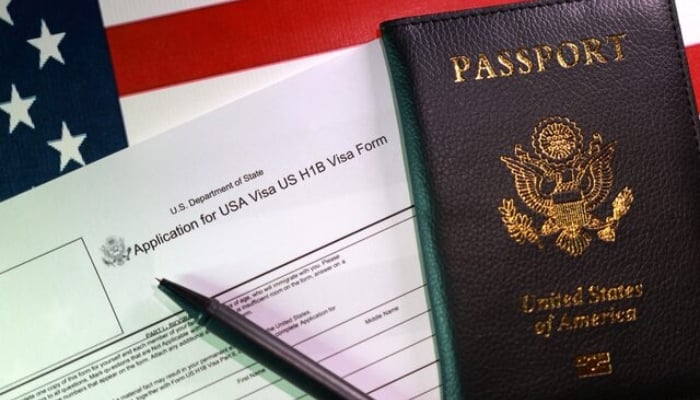 A U.S. flag, a passport and a U.S. H-1B Visa application form are seen in this illustration taken, September 22, 2025. — Reuters