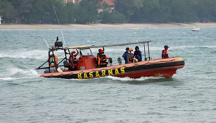 Team Rescue members ride on a rubber boat during a search operation for people who were reported missing in the waters of the Sunda Strait, including journalists covering the activity of Mount Anak Krakatau in Pandeglang, Banten province, Indonesia, September 9, 2026. — Reuters