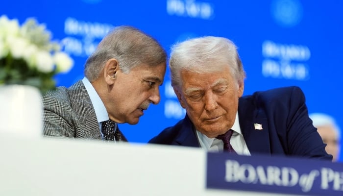 Prime Minister Shehbaz Sharif (left) speaks to US President Donald Trump at the Board of Peace meeting during the World Economic Forum (WEF) 2026 in Davos, January 22, 2026. — AFP