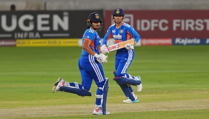 Indian batters Shafali Verma (left) and Smriti Mandhana run between the wickets during the Women’s Asia T20 Cup 2026 final against Sri Lanka at the Dubai International Cricket Stadium in Dubai on September 13, 2026. - ACC