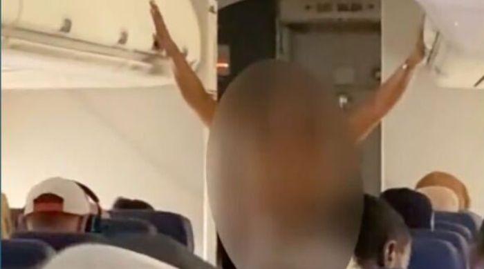 Female passenger removed from American Airlines flight after undressing midflight