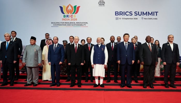 Heads of delegations pose for a family photo on day two of the Brics Summit in New Delhi, India, September 13, 2026. — Reuters