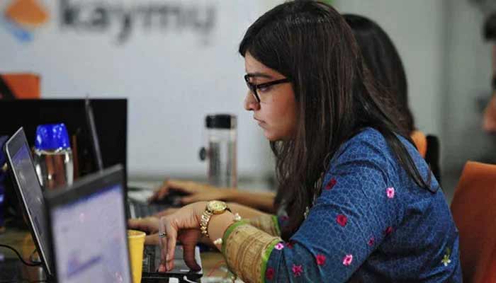 Pakistani employees of online marketplace company Kaymu at work in Karachi. — AFP/File