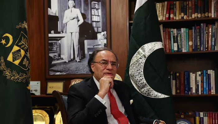 Finance Minister Muhammad Aurangzeb speaks during a Reuters interview, with a portrait of Mohammad Ali Jinnah, founder and first Governor-General of Pakistan, in the background, in Islamabad, June 15, 2026. — Reuters