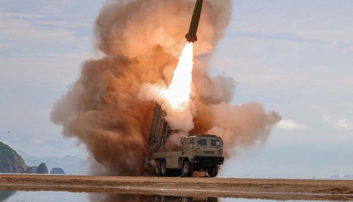 A rocket launcher fires a munition during tests, involving an upgraded version of a 240-mm, 24-tube multiple rocket launcher system, tactical ballistic missiles, and a 155-mm self-propelled howitzer, overseen by North Korean leader Kim Jong Un in North Korea, June 25, 2026. — Reuters