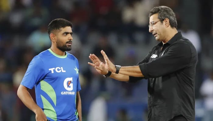Former Pakistan cricketer Wasim Akram (right) interacts with captain Babar Azam during the rain break in their ACC Mens Asia Cup 2023 Super Four match against India at the R Premadasa Stadium in Colombo on September 10, 2023. — AFP
