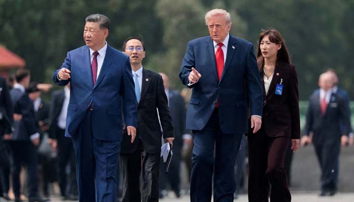 US President Donald Trump and Chinese President Xi Jinping walk together as they tour the Temple of Heaven in Beijing, China, May 14, 2026. — Reuters