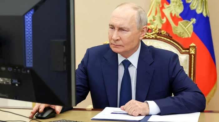 Putin's party set to retain power after Russia vote hit by cyberattacks, drones