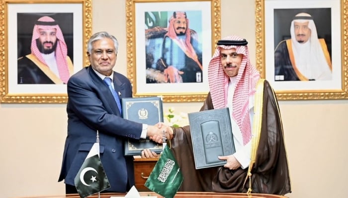 Deputy Prime Minister and Foreign Minister Ishaq Dar and his Saudi counterpart, Prince Faisal bin Farhan shaking hands after signing the agreement on September 22, 2026. — X@MIshaqDar50