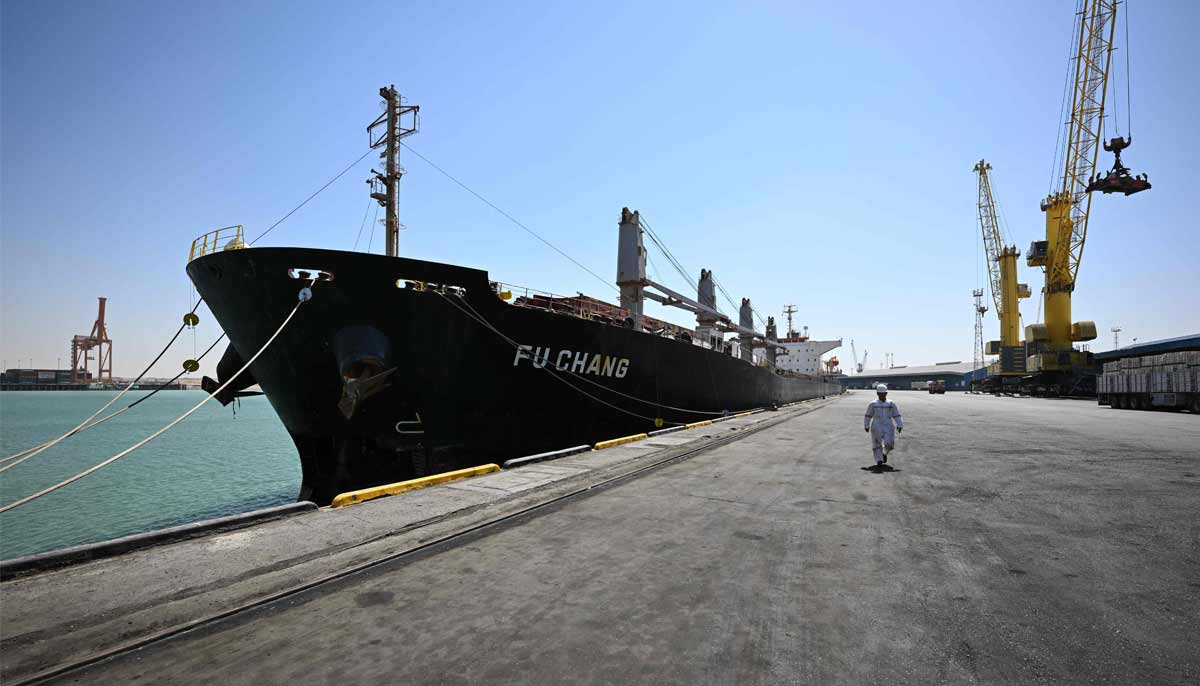 A crew member of the bulk carrier Fu Chang walks along a pier at the port of Umm Qasr in southern Iraq on September 17, 2026.— AFP