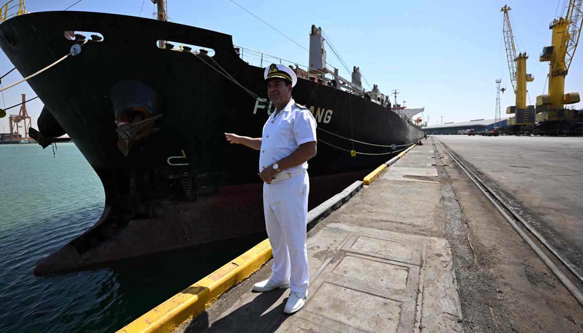 Captain Salem Hussein, the head of Umm Qasr ports northern sector, stands next to a commercial vessel docked at the port in southern Iraq on September 17, 2026.— AFP