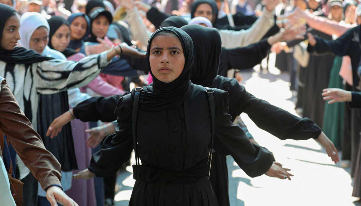 Displaced Palestinian student Samar Abu Salmi, 15, stands in line at a school in Khan Younis in the southern Gaza Strip, September 20, 2026.— Reuters