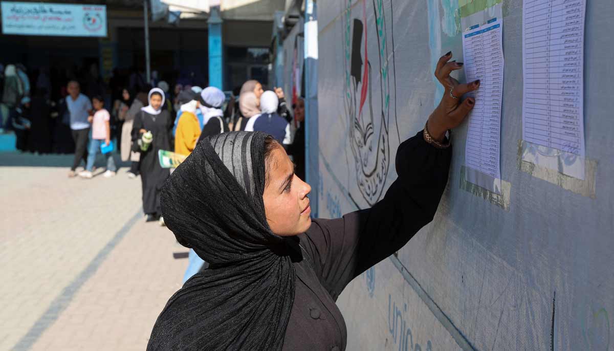 Displaced Palestinian student Samar Abu Salmi, 15, reads a list of names displayed in a school in Khan Younis, in the southern Gaza Strip, September 20, 2026. — Reuters