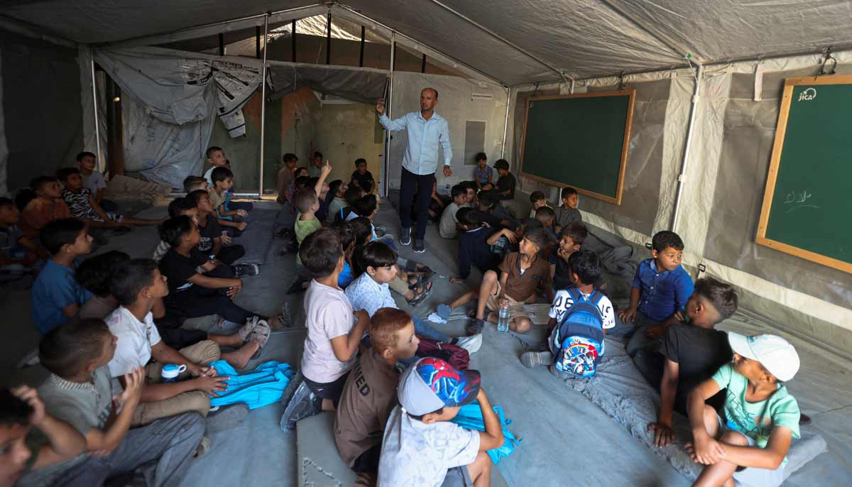 Palestinian students attend their first day of the new school year inside a tent classroom at a school in Khan Younis, in the southern Gaza Strip, September 19, 2026.— Reuters