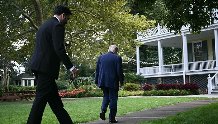 US President Donald Trump and New York City mayor Zohran Mamdani (L) walk towards Gracie Mansion after speaking with members of the press in New York, on September 21, 2026.